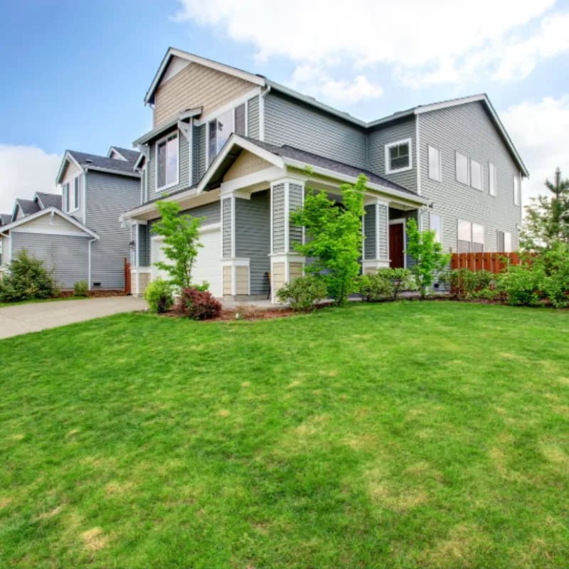 Residential property with immaculate lawn maintained by weekly cleaning