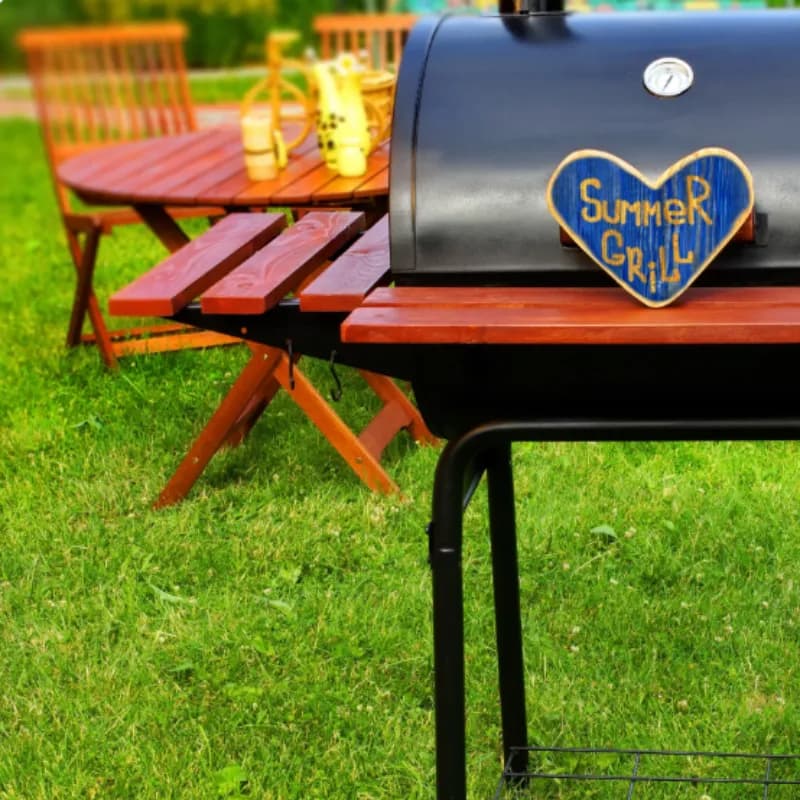 Clean backyard with summer grill and table ready for outdoor entertaining