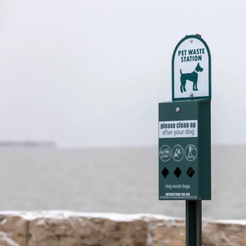 Pet waste station installed along scenic shoreline for public use