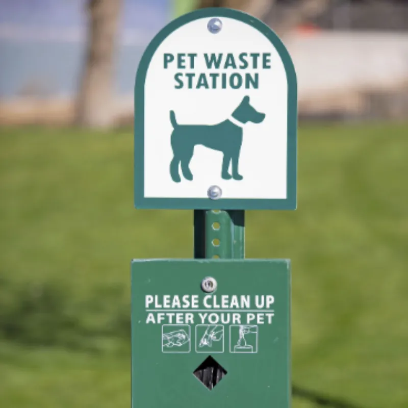 Well-maintained pet waste station with fresh supplies and clean appearance